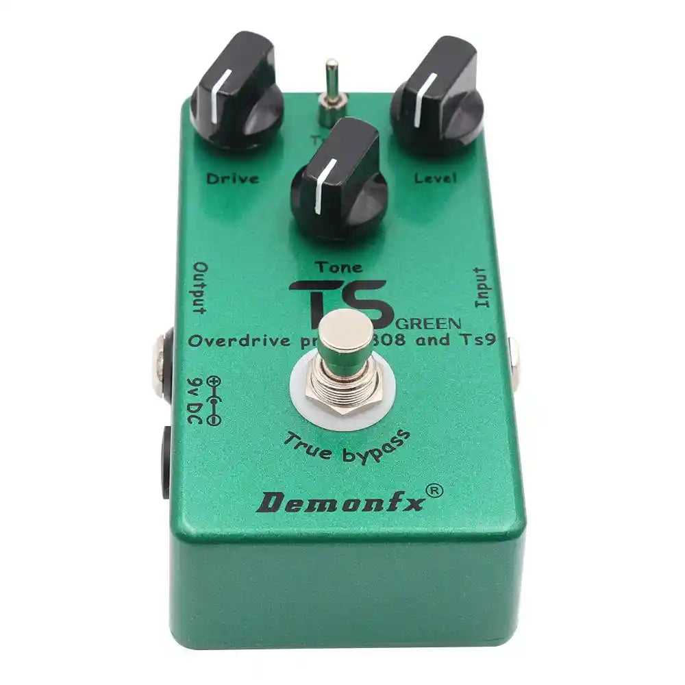 Demonfx TS GREEN dual overdrive booster pedal combining TS9 and TS808 features, with drive, tone, and level controls in a green metal casing.