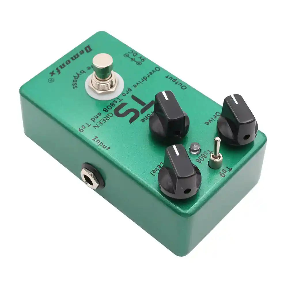 Demonfx TS GREEN dual overdrive booster pedal combining TS9 and TS808 features, with drive, tone, and level controls in a green metal casing.