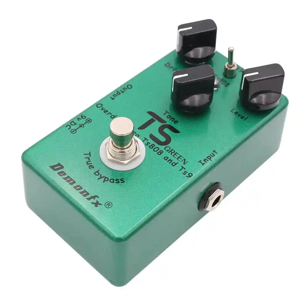 Demonfx TS GREEN dual overdrive booster pedal combining TS9 and TS808 features, with drive, tone, and level controls in a green metal casing.