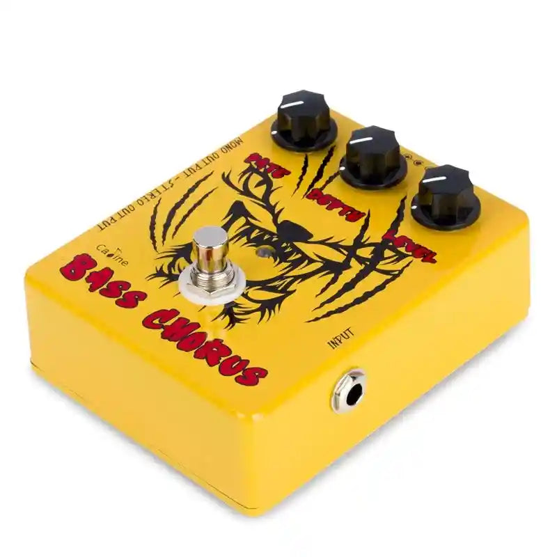 Caline CP-83 The Pumpkin Carver Bass Chorus pedal in yellow with black and red graphics, featuring Rate, Depth, and Level controls for sound customization.