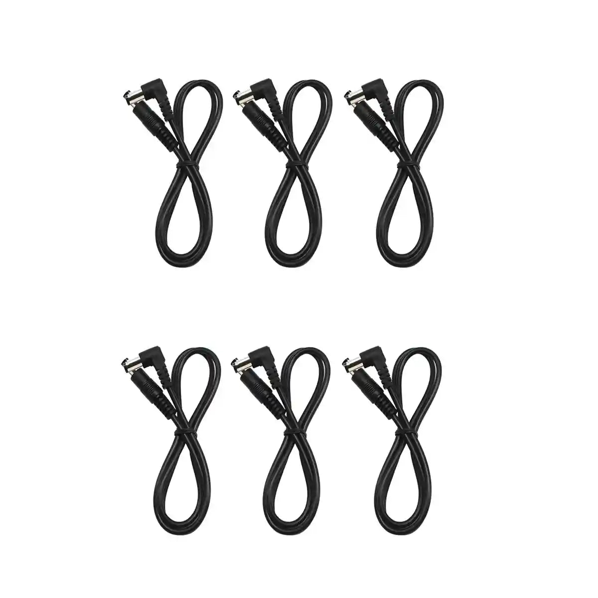 DC power cable for guitar pedals connected to a power supply and a green effects pedal. Features 5.5 x 2.1mm connectors and durable 24AWG copper wire.