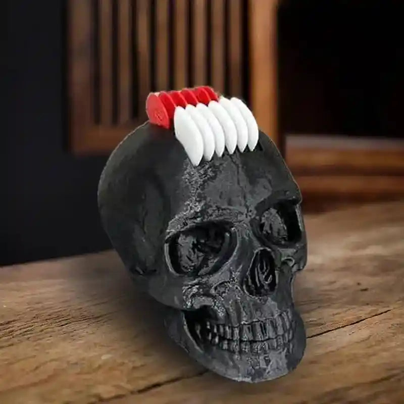Skull guitar pick holder with a realistic black skull design featuring a Mohawk-style arrangement of red and white guitar picks, perfect for gothic and punk rock enthusiasts.