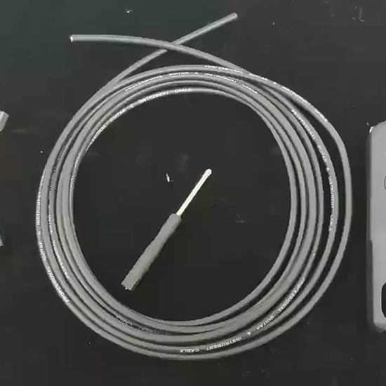 Solderless Connections Patch Cable Kit with cable, connectors, screwdriver, and cable cutter for easy pedal patch cable assembly.