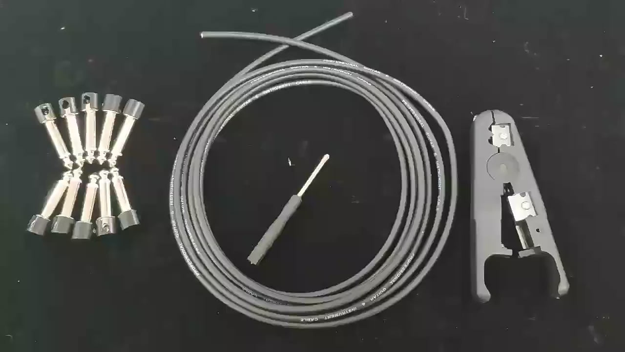 Solderless Connections Patch Cable Kit with cable, connectors, screwdriver, and cable cutter for easy pedal patch cable assembly.